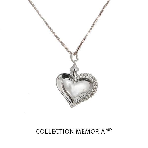 Silver heart pendant adorned with stones